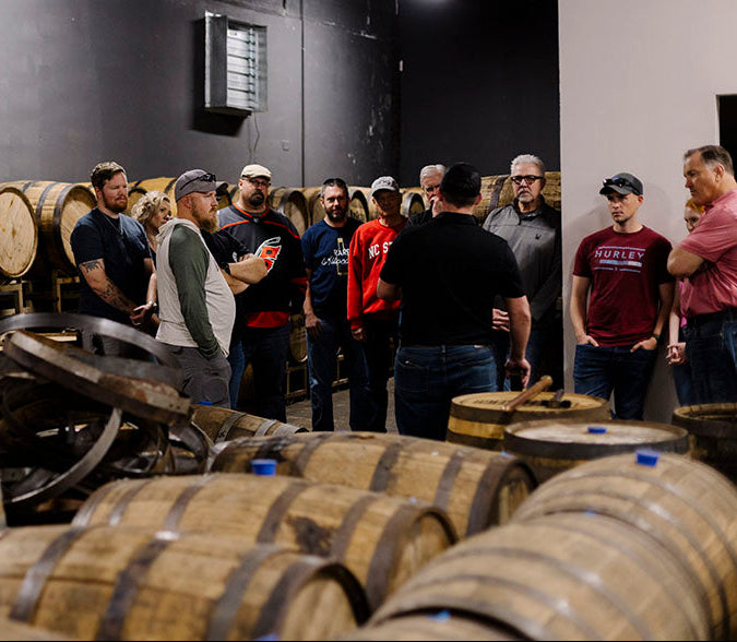 olde raleigh distillery tours photo of people in the barrel room