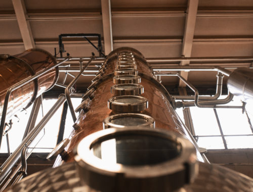 old raleigh distillery stills in production room